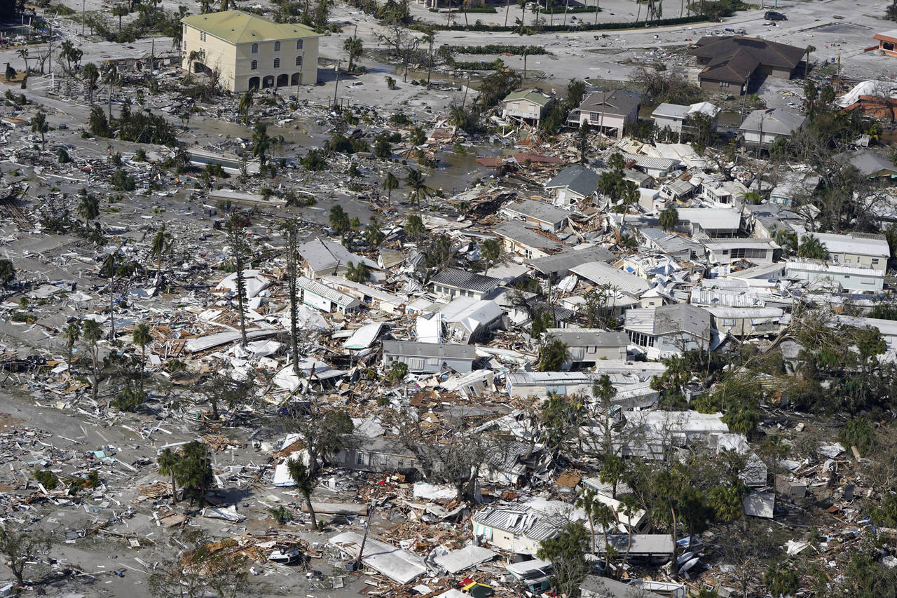 Damaged homes and debris are shown in the aftermath of Hurricane Ian, Thursday, Sept. 29, 2022, in ...