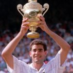 
              FILE - Pete Sampras holds his trophy, after defeating Boris Becker to win the Men's Singles Final on the Centre Court at Wimbledon Sunday July 9, 1995. Sampras defeated Becker 6-7 (5-7), 6-2, 6-4, 6-2 to win his third consecutive championship. Caulkin, a retired Associated Press photographer has died. He was 77 and suffered from cancer. Known for being in the right place at the right time with the right lens, the London-based Caulkin covered everything from the conflict in Northern Ireland to the Rolling Stones and Britain’s royal family during a career that spanned four decades. (AP Photo/Dave Caulkin, File)
            