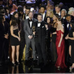 
              Jason Sudeikis, center, and the cast and crew of "Ted Lasso" accept the Emmy for outstanding comedy series at the 74th Primetime Emmy Awards on Monday, Sept. 12, 2022, at the Microsoft Theater in Los Angeles. (AP Photo/Mark Terrill)
            