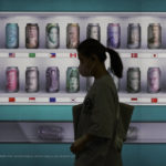 
              A woman walks by a bank's currency advertisement board in Seoul, South Korea, Friday, Sept. 23, 2022. Asian stocks fell for a third day Friday after more rate hikes by the Federal Reserve and other central banks to control persistent inflation spurred fears of a possible global recession. (AP Photo/Ahn Young-joon)
            