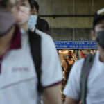 
              Commuters wearing face masks walk towards a bus stop in Manila, Philippines Thursday, Sept. 8, 2022. Philippine President Ferdinand Marcos Jr. has approved a recommendation to end the mandatory wearing of face masks outdoors across the country more than two years after it was imposed at the height of the coronavirus pandemic, top officials said Wednesday. (AP Photo/Aaron Favila)
            