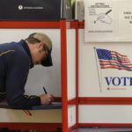 
              A voter fills out a ballot, Tuesday, Sept. 6, 2022, in the Massachusetts primary election at a polling place, in Attleboro, Mass. (AP Photo/Steven Senne)
            