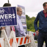 
              New Hampshire Republican 1st Congressional District Candidate Matt Mowers smiles while waiting to greet voters, Tuesday, Sept. 13, 2022, during a campaign stop at a polling station in Derry, N.H. (AP Photo/Charles Krupa)
            