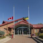 
              The flag of Canada and the flag of Saskatchewan are at half-mast to show respect to the victims of the stabbing rampage that happened at James Smith Cree Nation and Welton at the City Hall of Melfort in Saskatchewan, on Wednesday, Sept. 7, 2022. (Heywood Yu/The Canadian Press via AP)
            