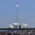 
              FILE - In this photo released by Xinhua News Agency, people gather at the beach as they watch the Long March 5B Y3 carrier rocket, carrying Wentian lab module, lift off from the Wenchang Space Launch Center in Wenchang in southern China's Hainan Province on July 24, 2022. Authorities warned of potential danger to aircraft and ships There has been no reported sighting in northern Philippine waters so far of debris from a new Chinese rocket launch, which prompted authorities to warn of potential danger to aircraft and ships, officials said Thursday, Sept. 15. (Zhang Liyun/Xinhua via AP, File)
            