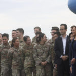 
              U.S. Vice President Kamala Harris, right, looks on next to service members at Yokota Air Base, near Tokyo, Japan, Thursday, Sept. 29, 2022. (Leah Millis/Pool Photo via AP)
            