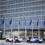 
              Police cars stand outside EU headquarters in Brussels after an incident was reported on Friday, Sept. 30, 2022. It was not immediately known the reason for the investigation. (AP Photo/Virginia Mayo)
            
