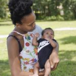 
              Venessa Aiken holds her son Jahzir Robinson, five weeks old, outside their home Sunday, Aug. 21, 2022, in Orlando, Fla. States around the country are making it easier for newborn moms to keep Medicaid in the year after childbirth, a crucial time when depression and other health problems can develop.(AP Photo/John Raoux)
            