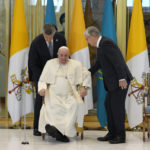 
              FILE - Pope Francis, left, meets the Kazakhstan's President Kassym-Jomart Tokayev as he arrives at Our-Sultan's International airport in Nur-Sultan, Kazakhstan, on Sept. 13, 2022. Chinese President Xi Jinping's first trip overseas since the early days of the COVID-19 pandemic will overlap with a visit by Pope Francis to Kazakhstan, although the Vatican says there are no plans for them to meet. (AP Photo/Andrew Medichini)
            