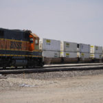 
              Freight cars pause next to a BNSF locomotive Wednesday, Sept. 14, 2022, in Oklahoma City. Business and government officials are preparing for a potential nationwide rail strike at the end of this week while talks carry on between the largest U.S. freight railroads and their unions. (AP Photo/Sue Ogrocki)
            