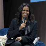 
              FILE - Former first lady Michelle Obama speaks to the crowd as she presents her anticipated memoir "Becoming" during her book tour stop in Washington, on Nov. 17, 2018. Obama plans a six-city tour this fall in support of her new book, “The Light We Carry: Overcoming in Uncertain Times,” beginning mid-November in Washington. D.C. and ending a month later in Los Angeles. (AP Photo/Jose Luis Magana, File)
            