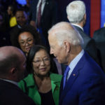 
              President Joe Biden speaks with Sen. Chris Coons, D-Del., left, and Sen. Mazie Hirono, D-Hawaii, after speaking at the United We Stand Summit in the East Room of the White House in Washington, Thursday, Sept. 15, 2022. (AP Photo/Susan Walsh)
            