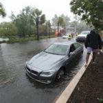
              Several motorists are stuck in flooding during effects from Hurricane Ian, Friday, Sept. 30, 2022, in Charleston, S.C. (AP Photo/Alex Brandon)
            