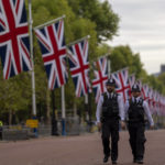 
              Police officers patrol near Buckingham Palace in London, Monday, Sept. 12, 2022. Queen Elizabeth II, Britain's longest-reigning monarch and a rock of stability across much of a turbulent century, died Thursday Sept. 8, 2022, after 70 years on the throne. She was 96. Queen Elizabeth II, Britain's longest-reigning monarch and a rock of stability across much of a turbulent century, died Thursday Sept. 8, 2022, after 70 years on the throne. She was 96. (AP Photo/Emilio Morenatti)
            