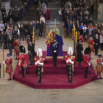 
              Queen Elizabeth II 's grandchildren, clockwise from front centre, Prince William, the Prince of Wales, Peter Phillips, James, Viscount Severn, Princess Eugenie, Prince Harry, , the Duke of Sussex, obscured, Princess Beatrice, Lady Louise Windsor and Zara Tindall bow, during the vigil of the Queen's grandchildren, as they stand by the coffin of Queen Elizabeth II, as it lies in state, in Westminster Hall, at the Palace of Westminster, London, Saturday,  Sept. 17, 2022, ahead of her funeral on Monday.( Aaron Chown/Pool Photo via AP)
            