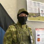 
              A Donetsk People's Republic serviceman stands guard at a polling station prior to a referendum in Donetsk, Donetsk People's Republic, controlled by Russia-backed separatists, eastern Ukraine, Thursday, Sept. 22, 2022. Authorities in Russian-controlled regions in eastern and southern Ukraine are preparing to hold referendums on becoming part of Russia's a move that could allow Moscow to escalate the war. The votes start Friday in the Luhansk, Kherson and partly Russian-controlled Zaporizhzhia and Donetsk regions. (AP Photo)
            