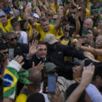 
              President Jair Bolsonaro greets supporters in Copacabana beach during the country's bicentennial independence celebrations, in Rio de Janeiro, Brazil, Wednesday, Sept. 7, 2022. (AP Photo/Rodrigo Abd)
            