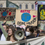 
              Climate activists attend a demonstration in Berlin, Friday, Sept. 23, 2022. Youth activists staged a coordinated “global climate strike” on Friday to highlight their fears about the effects of global warming and demand more aid for poor countries hit by wild weather. (Monika Skolimowska/dpa via AP)
            