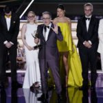 
              John Oliver, center, and the team from "Last Week Tonight with John Oliver" accepts the Emmy for outstanding variety talk series at the 74th Primetime Emmy Awards on Monday, Sept. 12, 2022, at the Microsoft Theater in Los Angeles. (AP Photo/Mark Terrill)
            