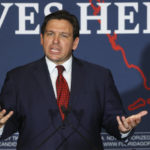 
              FILE - Florida Gov. Ron DeSantis speaks to a crowd of supporters during the Keep Florida Free Tour on Wednesday, Aug. 24, 2022, in Tampa, Fla. DeSantis on Wednesday, Sept. 14 flew two planes of immigrants to Martha's Vineyard, escalating a tactic by Republican governors to draw attention to what they consider to be the Biden administration's failed border policies.  (Luis Santana/Tampa Bay Times via AP, File)
            