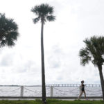 
              A jogger runs along a sea wall, Monday, Sept. 26, 2022, in Miami.  States are spending billions of dollars of federal pandemic relief funds on infrastructure projects such as roads, bridges and public buildings. The American Rescue Plan law signed by President Joe Biden last year provided $350 billion to states and local governments to respond to the coronavirus and shore up their economies. (AP Photo/Marta Lavandier)
            