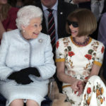 
              FILE - This is a Tuesday, Feb. 20, 2018 file photo of Britain's Queen Elizabeth, left, sitting next to fashion editor Anna Wintour as they view Richard Quinn's runway show before presenting him with the inaugural Queen Elizabeth II Award for British Design, as she visits London Fashion Week's BFC Show Space in central London. Queen Elizabeth II, Britain’s longest-reigning monarch and a rock of stability across much of a turbulent century, has died. She was 96. Buckingham Palace made the announcement in a statement on Thursday Sept. 8, 2022. (Yui Mok/ Pool Photo via AP, File)
            