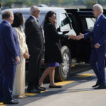 
              President Joe Biden shakes hands with Rep. Rashida Tlaib, D-Mich., as he arrives at Detroit Metropolitan Airport, Wednesday, Sept. 14, 2022, in Detroit. From left, Detroit Mayor Mike Duggan, his wife Sonia Hassan, Wayne County Executive Warren Evans and Tlaib. (AP Photo/Evan Vucci)
            