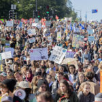 
              People take part in a climate change march in Montreal, Friday, Sept. 23, 2022. (Graham Hughes/The Canadian Press via AP)
            