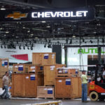 
              Workers set up for the North American International Auto Show in Detroit, Wednesday, Sept. 7, 2022. The show will be smaller with few new model debuts, less-glitzy displays, fewer journalists and lower attendance that past years. (AP Photo/Paul Sancya)
            