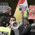 
              Demonstrators shout slogans outside Iran's embassy in Oslo, Norway, Thursday, Sept. 29, 2022, as they protest the death of 22-year-old Mahsa Amini in custody in Iran after she was detained by the country’s morality police. Several people attempted to enter the Iranian Embassy in Oslo, police said Thursday, with scuffles breaking out and rocks being thrown at officers with authorities saying some 90 people had been detained. (Terje Pedersen/NTB Scanpix via AP)
            
