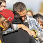 
              Darryl Burns, brother of victim Gloria Burns, embraces another family member of a victim during a Federation of Sovereign Indigenous Nations event where leaders provide statements about the mass stabbing incident that happened at James Smith Cree Nation and Weldon, Saskatchewan, Canada, at James Smith Cree Nation, Saskatchewan, Canada, on Thursday, Sept. 8, 2022. (Heywood Yu/The Canadian Press via AP)
            