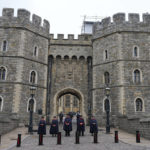
              Wardens stand outside the gates of Windsor Castle in Windsor, England, Friday, Sept. 9, 2022. Queen Elizabeth II, Britain's longest-reigning monarch and a rock of stability across much of a turbulent century, died Thursday after 70 years on the throne. She was 96. (AP Photo/Frank Augstein)
            