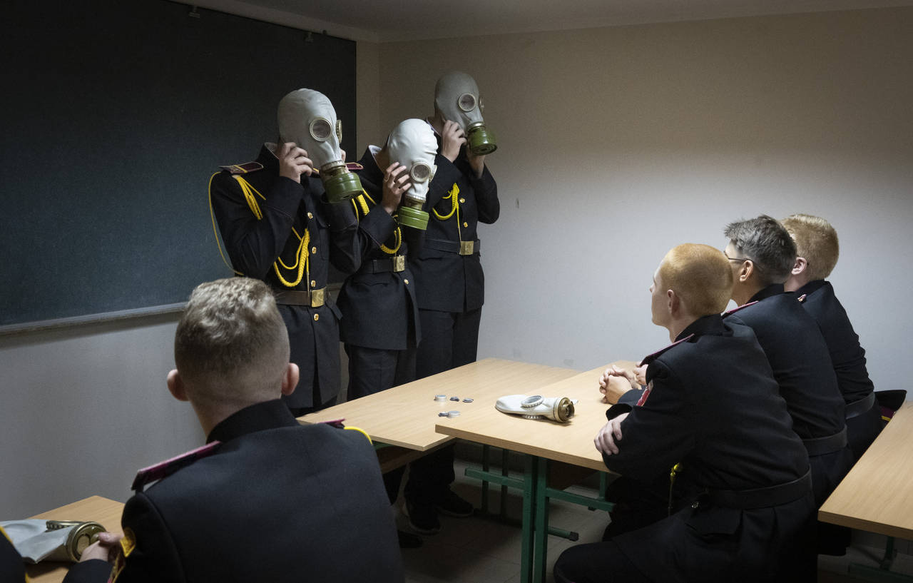 Cadets practice an emergency situation during a lesson in a bomb shelter on the first day of school...