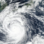 
              This Saturday, Sept. 17, 2022 satellite image released by NASA shows Typhoon Nanmadol, which is approaching southwest Japan. (NASA Worldview, Earth Observing System Data and Information System (EOSDIS) via AP)
            
