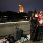 
              Grace, left, and Anne wait opposite the Palace of Westminster to be first in line to bid farewell to Queen Elizabeth II in London, Sept. 12, 2022. (AP Photo/Markus Schreiber)
            