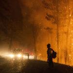 
              A firefighter monitors the Mosquito Fire as embers swirl in the air near Michigan Bluff in unincorporated Placer County, Calif. Wednesday, Sept. 7, 2022. (Stephen Lam/San Francisco Chronicle via AP)
            