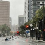 
              A stoplight pole blown down by Hurricane Ian winds, rests on Orange Avenue in Downtown Orlando, Fla., on Thursday, Sept. 29, 2022.   Hurricane Ian has left a path of destruction in southwest Florida, trapping people in flooded homes, damaging the roof of a hospital intensive care unit and knocking out power. (Willie J. Allen Jr./Orlando Sentinel via AP)
            