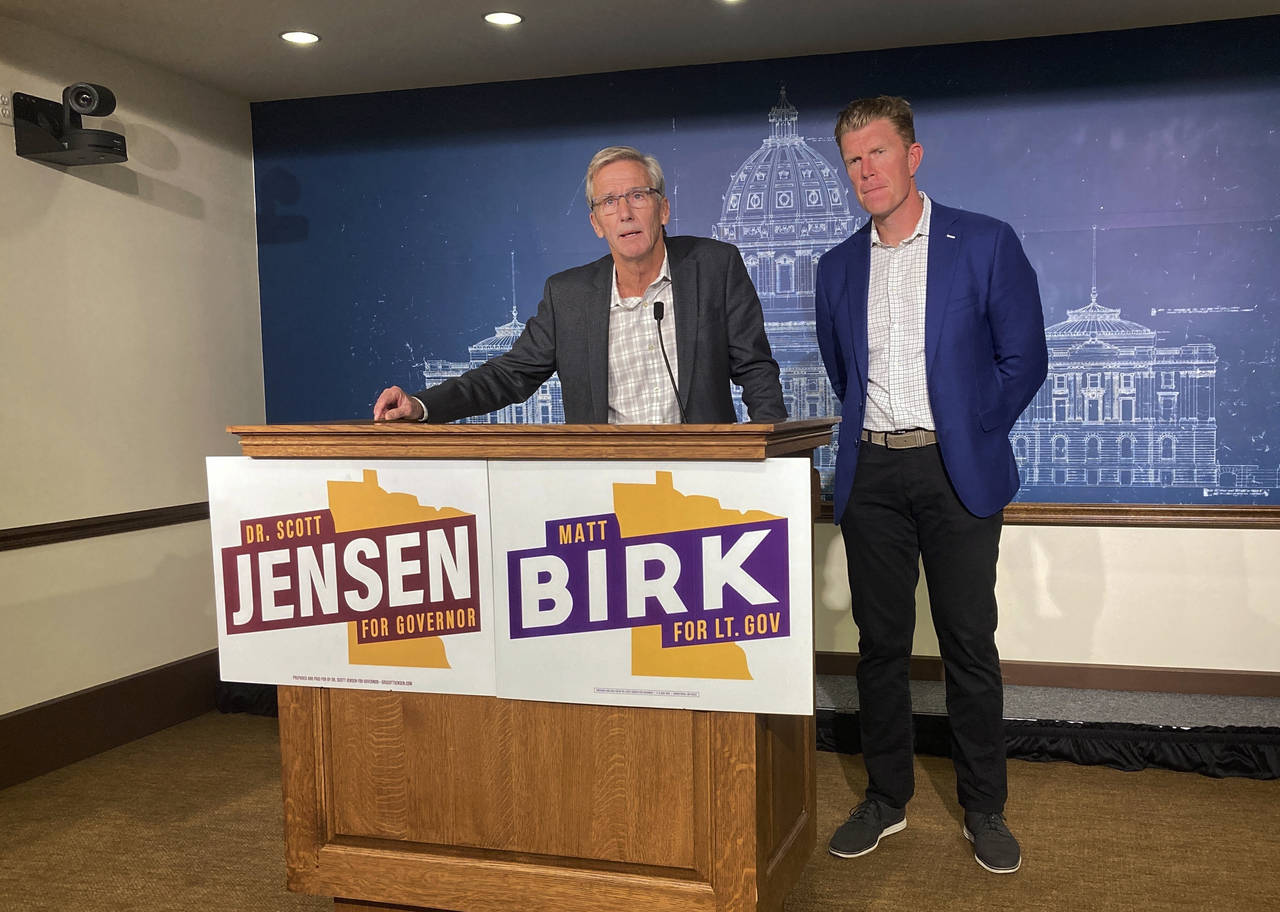 GOP gubernatorial candidate Scott Jensen, left, and his running mate, Matt Birk, speak at a news co...