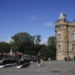 
              King Charles III inspects the Guard of Honour as he arrives to attend the Ceremony of the Keys, at the Palace of Holyroodhouse, Edinburgh, Monday, Sept. 12, 2022. King Charles arrived in Edinburgh on Monday to accompany his late mother’s coffin on an emotion-charged procession through the historic heart of the Scottish capital to a cathedral where it will lie for 24 hours to allow the public to pay their last respects. (Peter Byrne/Pool Photo via AP)
            