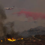 
              An air tank drops retardant on a wildfire burning on a hillside Tuesday, Sept. 6, 2022, near Hemet, Calif. (AP Photo/Ringo H.W. Chiu)
            