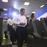 
              Greece's Prime Minister Kyriakos Mitsotakis, observes a Rafale fighter jet simulator, during a tour of Thessaloniki International Trade Fair, in the northern Greek city of Thessaloniki, Saturday, Sept. 10, 2022. On his keynote speech, set for later Saturday, Mitsotakis is expected to announce measures concerning mainly the energy crisis and high prices. (AP Photo/Giannis Papanikos)
            