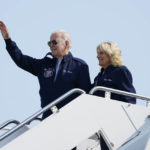 
              President Joe Biden waves as he stands at the top of the steps of Air Force One before boarding with first lady Jill Biden at Andrews Air Force Base, Md., Saturday, Sept. 17, 2022, as they head to London to attend the funeral for Queen Elizabeth II. To commemorate the U.S. Air Force's 75th Anniversary as a service the Bidens are wearing Air Force One jackets. (AP Photo/Susan Walsh)
            