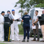 
              Investigators gather in front of the scene of a stabbing in Weldon, Saskatchewan, Sunday, Sept. 4, 2022. A series of stabbings at an Indigenous community and at another in the village of Weldon left multiple people dead and others wounded, Canadian police said Sunday as they searched for two suspects. (Heywood Yu/The Canadian Press via AP)
            