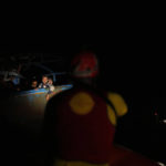 
              Migrants wait to be rescued by members of the Spanish NGO Open Arms lifeguard during a rescue operation at the Mediterranean sea, early Sunday, Sept. 18, 2022. Around 200 migrants from Syria and Africa countries were rescued by NGO Open Arms crew members. (AP Photo/Petros Karadjias)
            