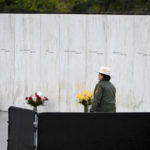 
              A National Park Service Ranger walks past the Wall of Names before a ceremony commemorating the 21st anniversary of the Sept. 11, 2001 terrorist attacks at the Flight 93 National Memorial in Shanksville, Pa., Sunday, Sept. 11, 2022. (AP Photo/Barry Reeger)
            