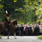 
              A member of The King's Troop Royal Horse Artillery rides past spectators ahead of the Gun Salute at London's Hyde Park to mark the death of Queen Elizabeth II on Thursday, in London, Friday, Sept. 9, 2022. (Kirsty O'Connor/PA via AP)
            