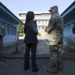 
              U.S. Vice President Kamala Harris, center left, stands next to the demarcation line at the demilitarized zone (DMZ) separating the two Koreas, in Panmunjom, South Korea Thursday, Sept. 29, 2022. (Leah Millis/Pool Photo via AP)
            