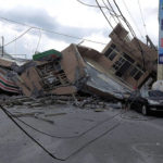 
              This photo provided by Hualien County fire department show a collapsed residential building  following earthquake in Yuli township in Hualien County, eastern Taiwan, Sunday, Sept. 18, 2022. A 7-11 convenience store was at the first floor of the collapse building. A strong earthquake shook much of Taiwan on Sunday, toppling at least one building and trapping two people inside and knocking part of a passenger train off its tracks at a station.(Hualien County Fire Department via AP)
            