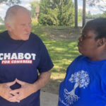 
              Rep. Steve Chabot, R-Ohio, talks with constituent Latesha Wilson, right, at a park in Reading, Ohio, on Sunday, Sept. 18, 2022. Chabot has tried to tie his Democratic opponent, Cincinnati city council member Greg Landsman, to President Joe Biden, helping illustrate how some Democratic candidates are struggling with how much to embrace -- or distance themselves -- from the president ahead of November’s midterm elections. (AP Photo/Will Weissert)
            
