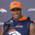 
              Denver Broncos quarterback Russell Wilson responds to a question during a news conference before the NFL football team's practice Thursday, Sept. 8, 2022, at the Broncos' headquarters in Centennial, Colo. The Broncos open the NFL season Monday night against the Seahawks in Seattle. (AP Photo/David Zalubowski)
            